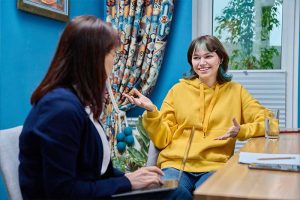 Participant talking with support worker